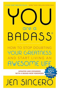 Bright yellow cover of the book You Are a Badass by Jen Sincero