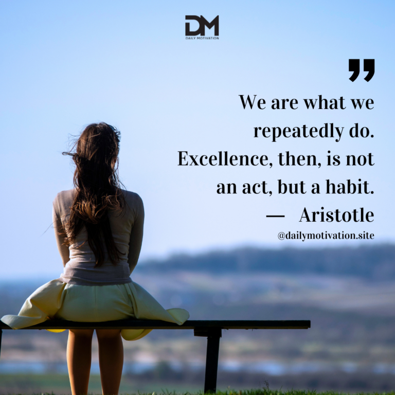 A woman in a dress sits on a bench, looking at the view beyond.