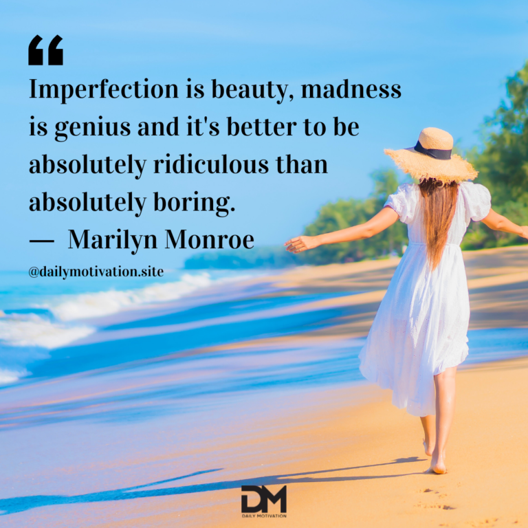 A woman in a white dress and sunhat walks with her arms out on the beach with the tide going out.