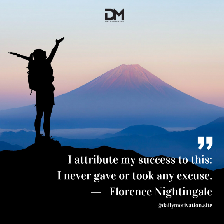 Someone stands in silhouette on top of a high cliff with their arms out, looking at a faraway mountain.