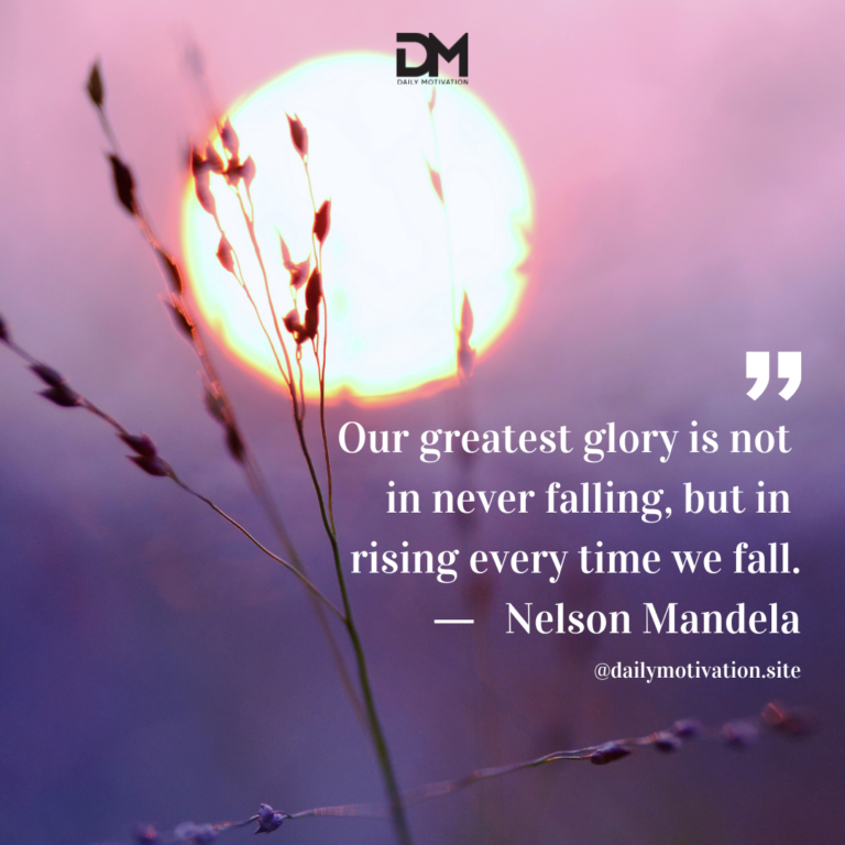 A purple sky with a blazing setting sun and a long piece of grass in the foreground.