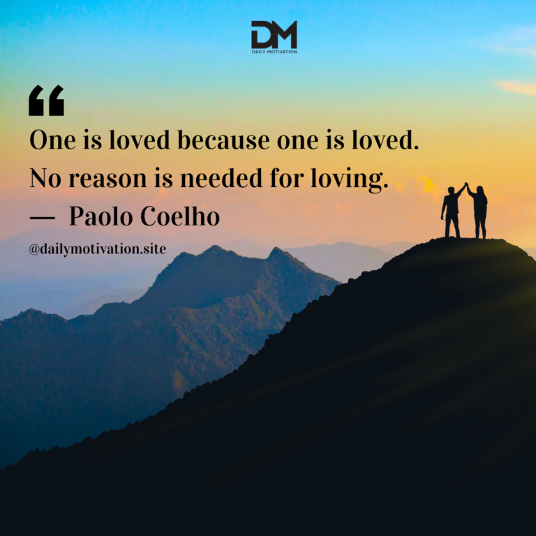 Two people high five on top of a mountain with the blue, orange and pink sky beyond.