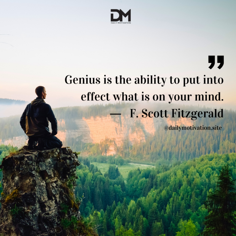 A man sits on a rock overlooking a lush green valley below.