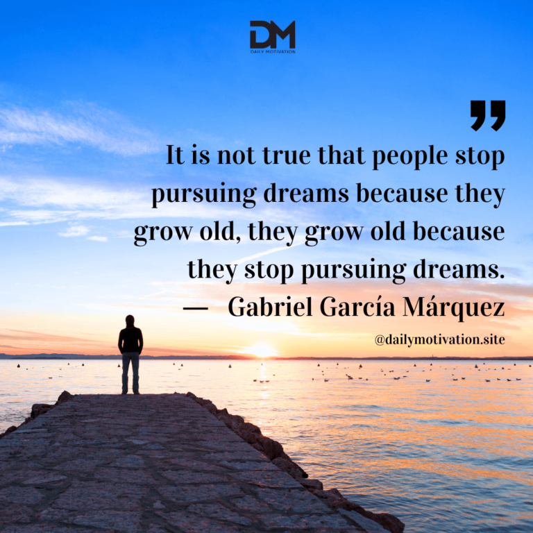 A person stands at the edge of a rocky outpost, looking out at the sunset.