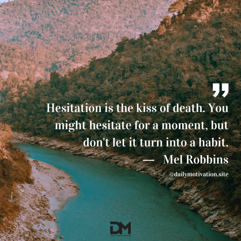 An aqua colored river flows through a rocky mountain range.