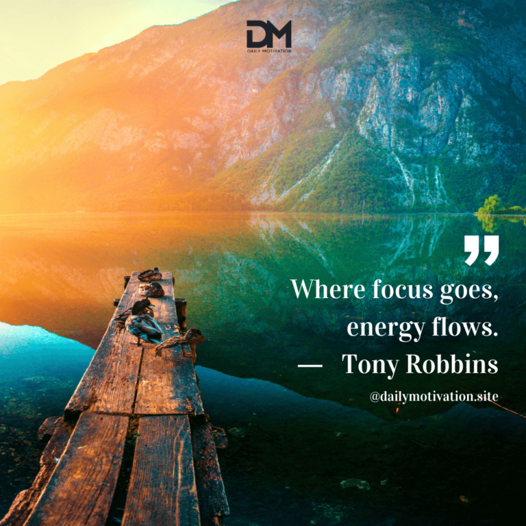 A rustic dock sits on a serene, jewel-toned lake with mountains beyond.