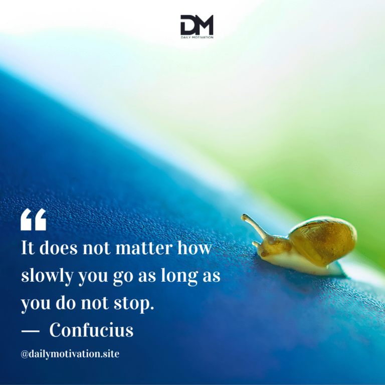 A yellow snail makes its way up a blue rock.