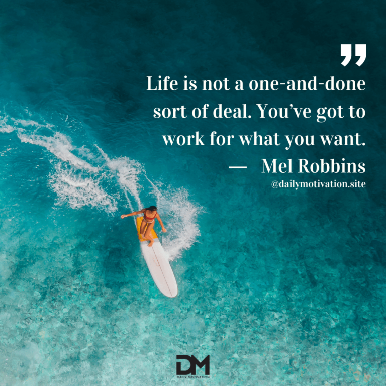 A birds eye view of someone surfing, the white surfboard in sharp contrast to the clear aqua water.