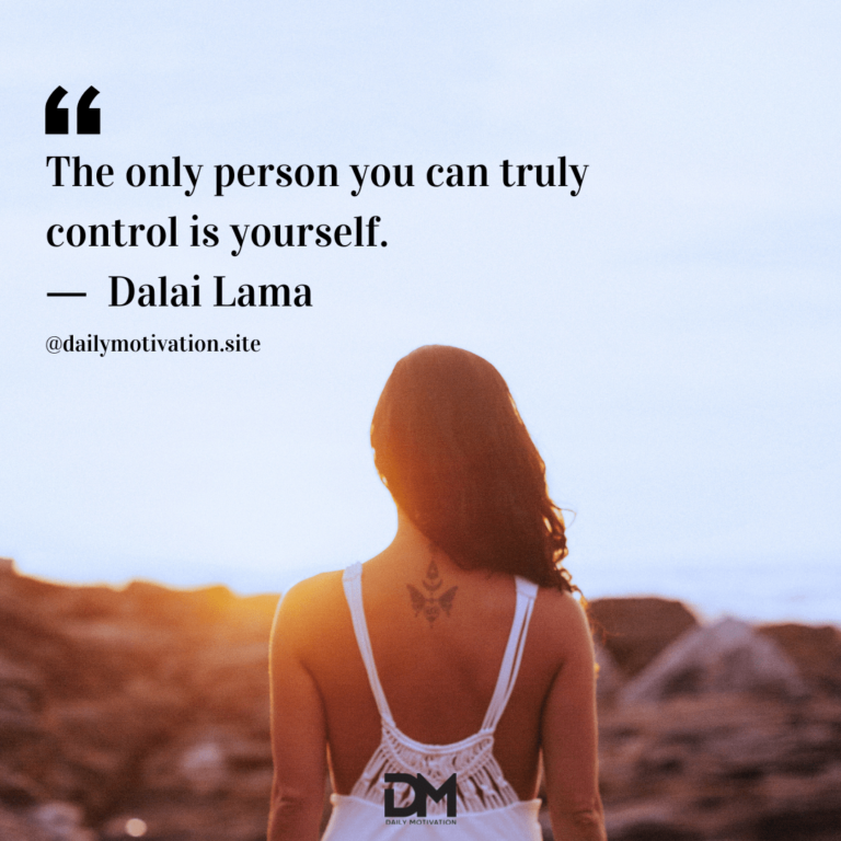 A woman in a white tank top stands facing the rising sun, coming up over a cliff.