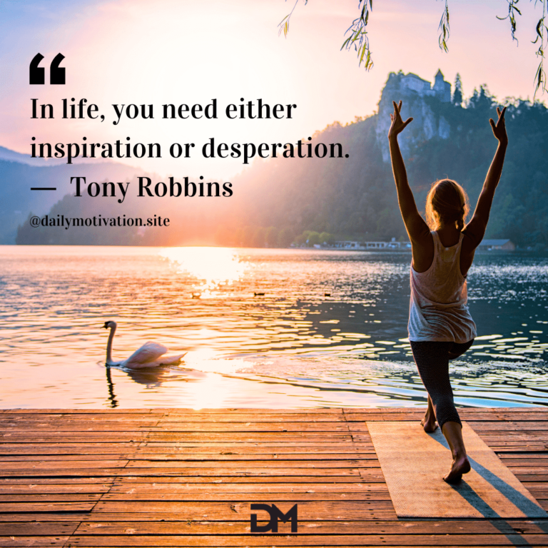 A woman does yoga on a mat on a dock looking out a a clear lake and rising sun.