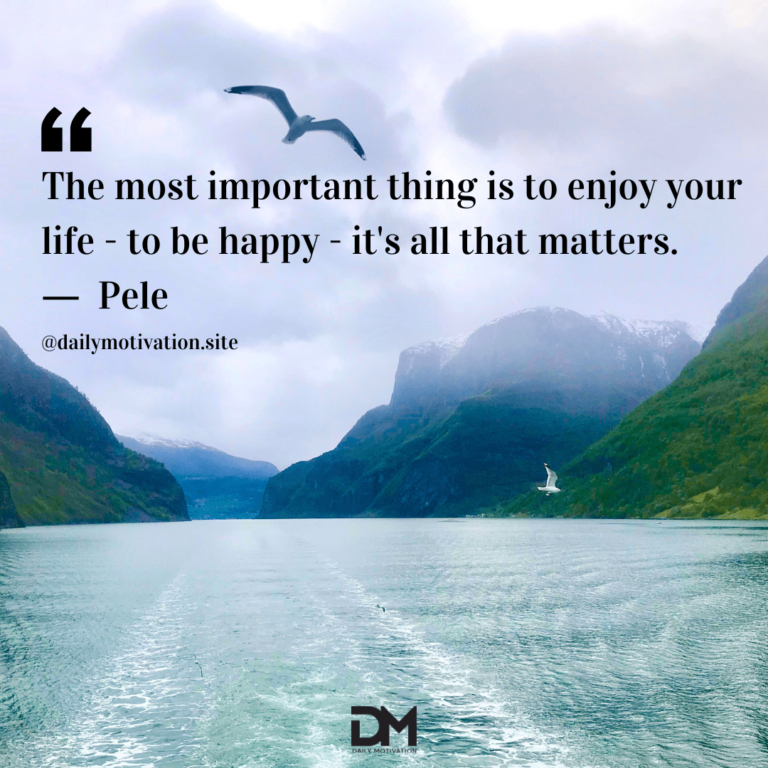 A rippling green-blue lake amid towering green cliffs and a seagull floating above.