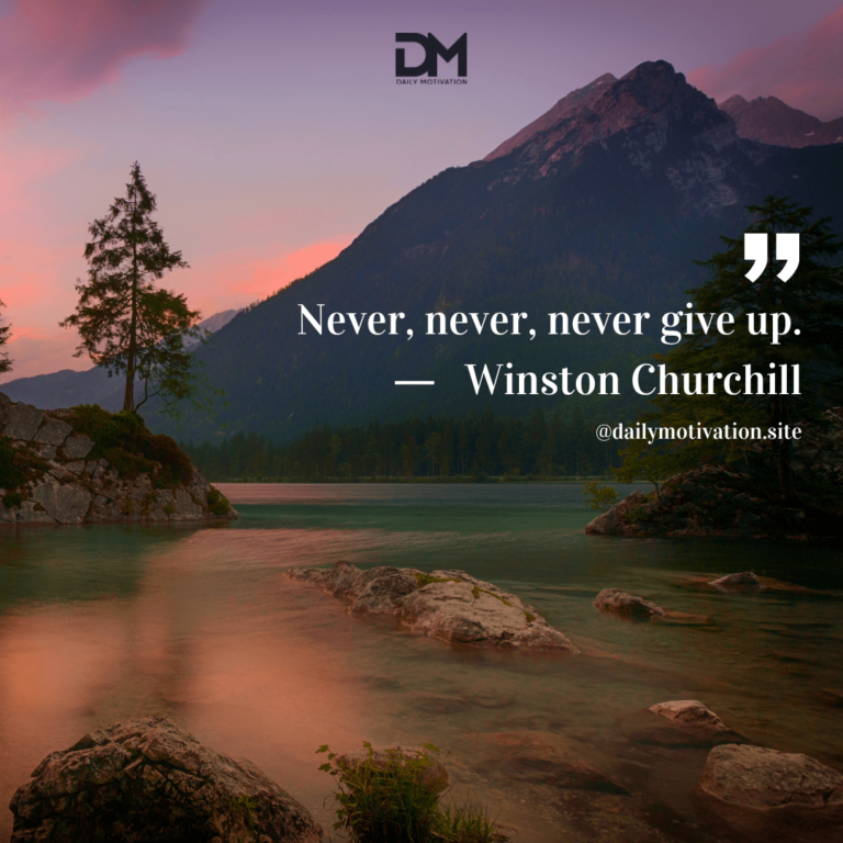 A purple sunrise over a calm lake with the mountains in the distance.