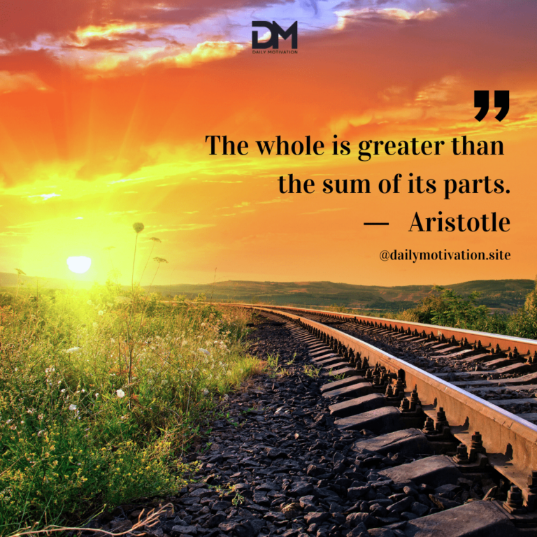 A bright orange sky along a railroad track at sunset.