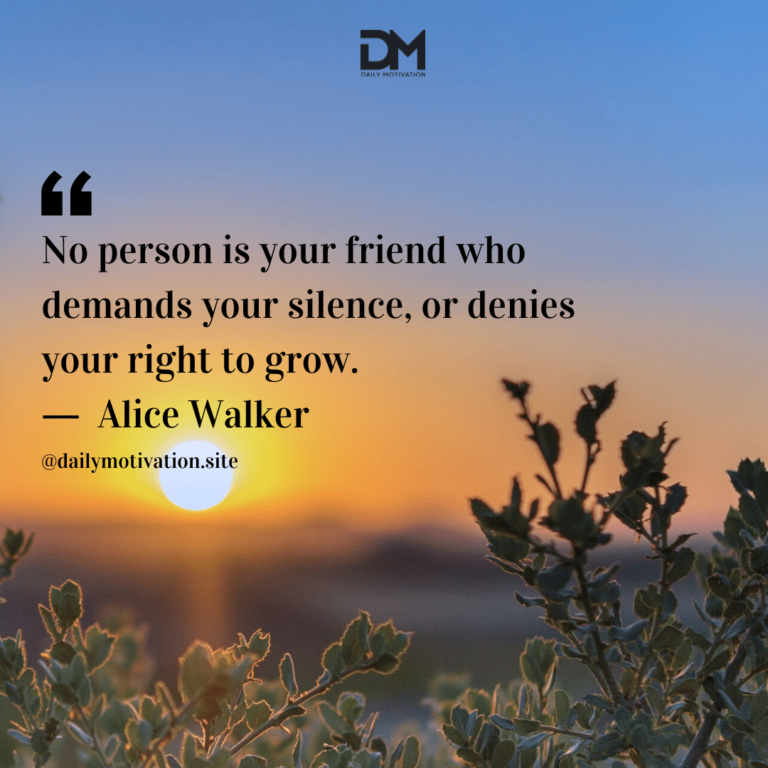 The sun goes down beyond a close up of a bush.