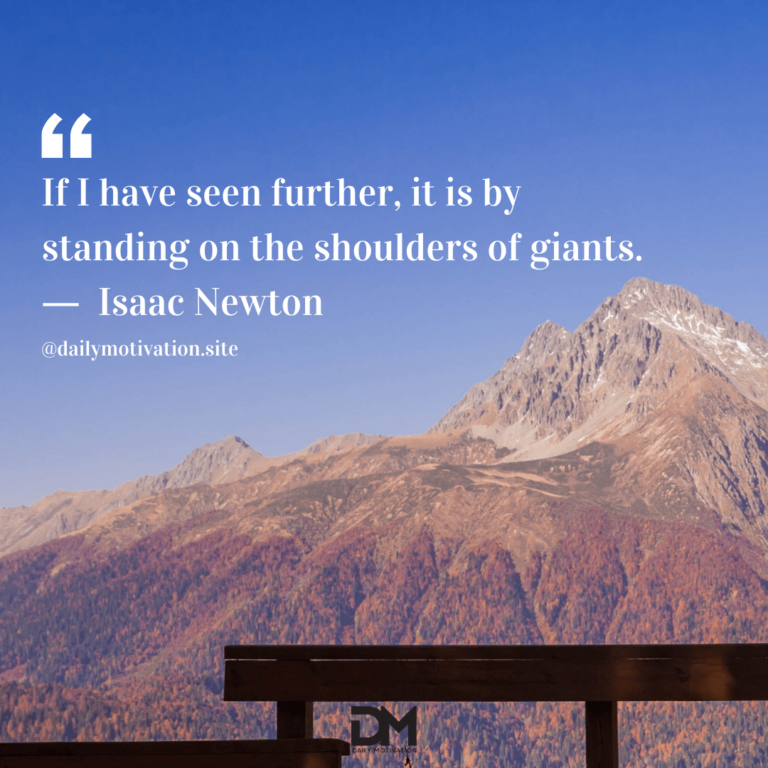 A railing in front of a vast mountain range in the distance.