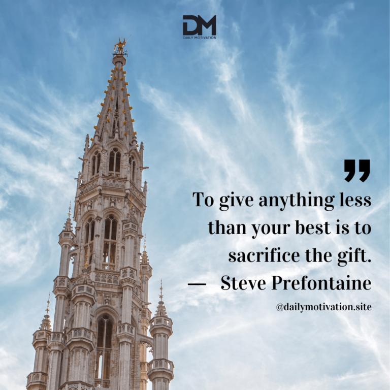 Brussels Town Hall tower with a light blue sky beyond.
