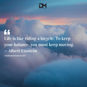 Blue and pink fluffy clouds gather in the sunrise.