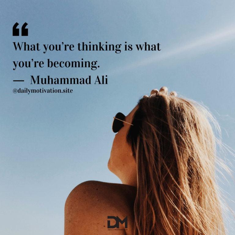 Woman with long hair and sunglasses looks up at sky.