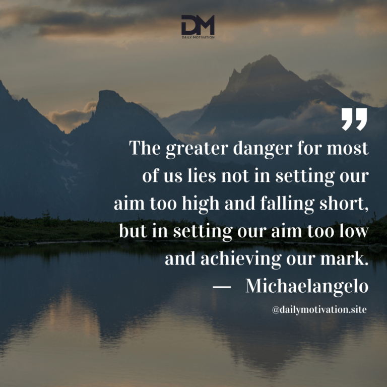 A grey sky with the mountains beyond a calm lake, which shows the reflection.