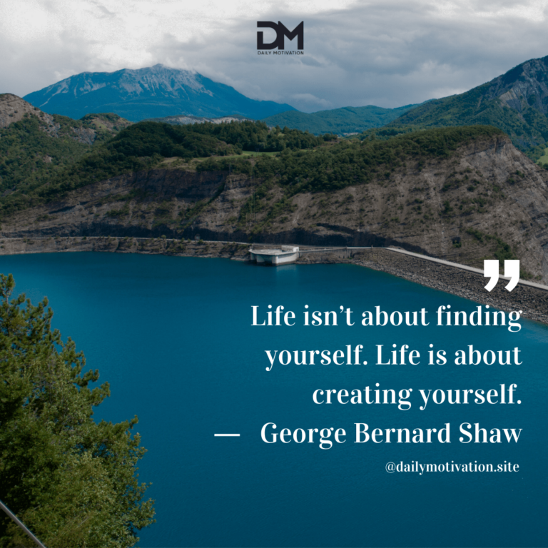 A beautiful blue lake surrounded by green hills and mountains beyond.