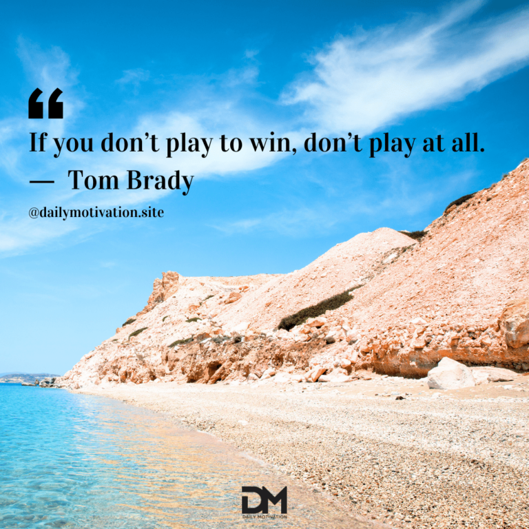 Bright sandy beach and hill along the blue ocean shore.