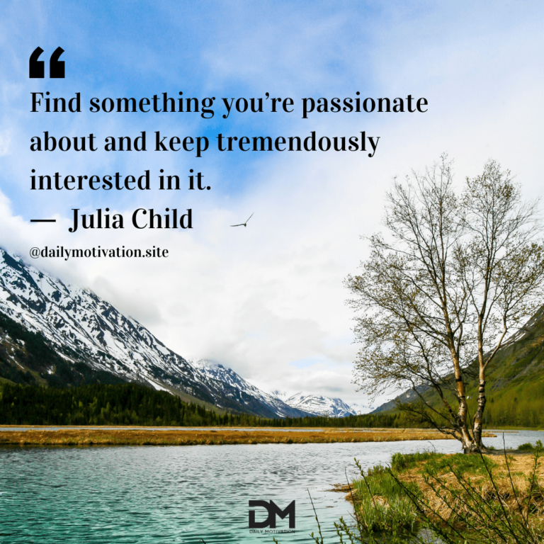 Snowy mountains amidst white cloud above a clear blue lake.