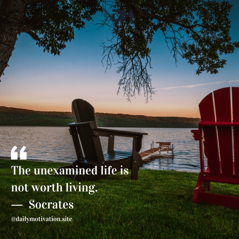 Two Adirondack chairs sit by the water.