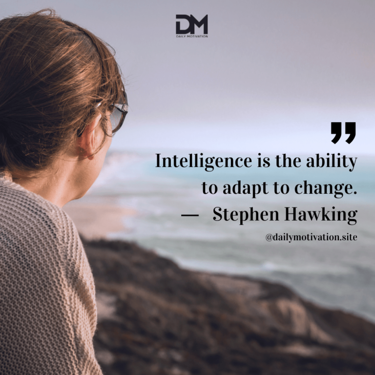Woman looks out at the rocks and ocean.