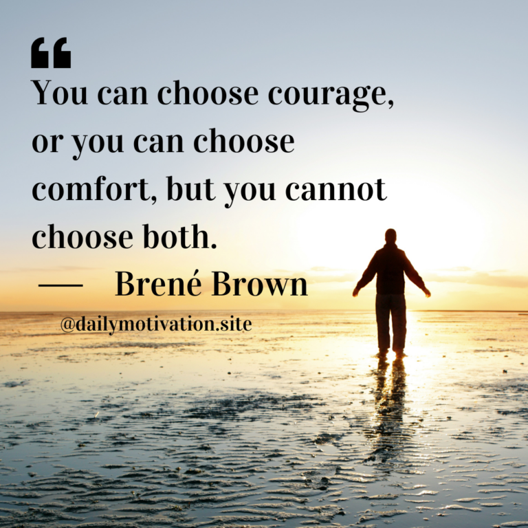 A person stands on the wet shore at low tide.