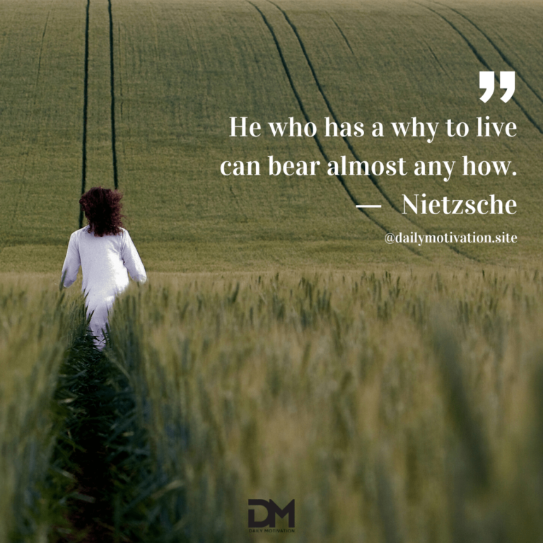 Woman in white walks through large green field.