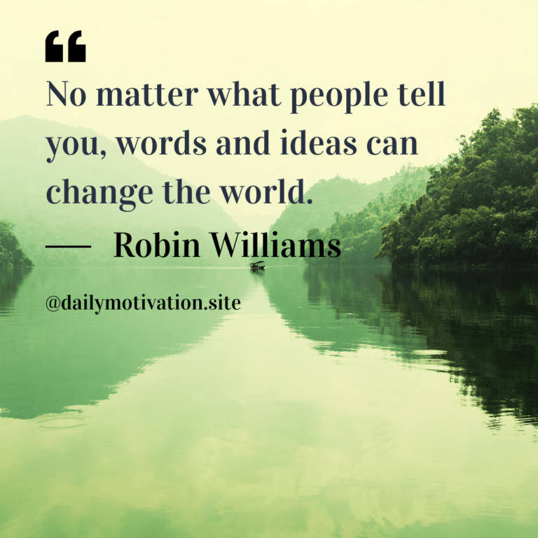 Calm water reflects green trees and hills under a yellow sky.