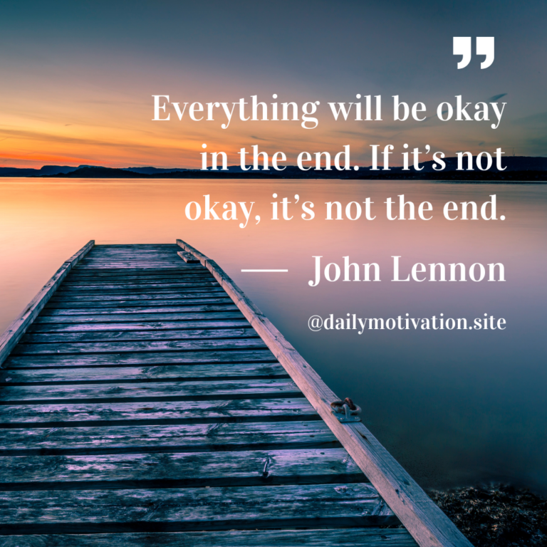 A wooden dock leading to the water and an orange sky.