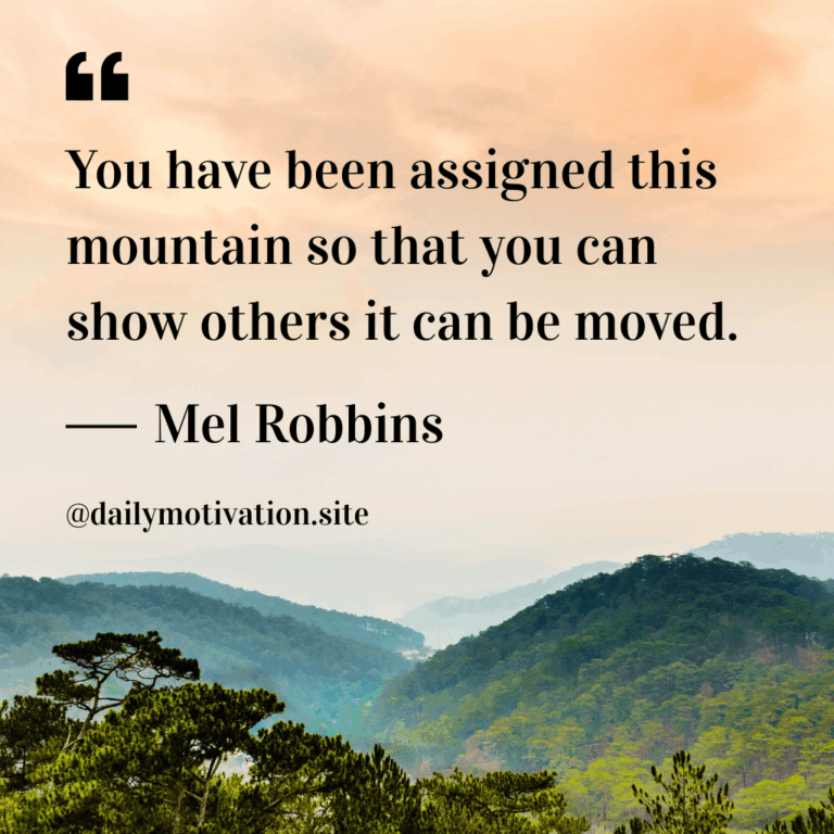 A light orange sky above a mountain range.