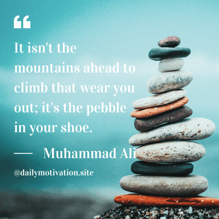 A stack of flat rocks in front of a blue background.