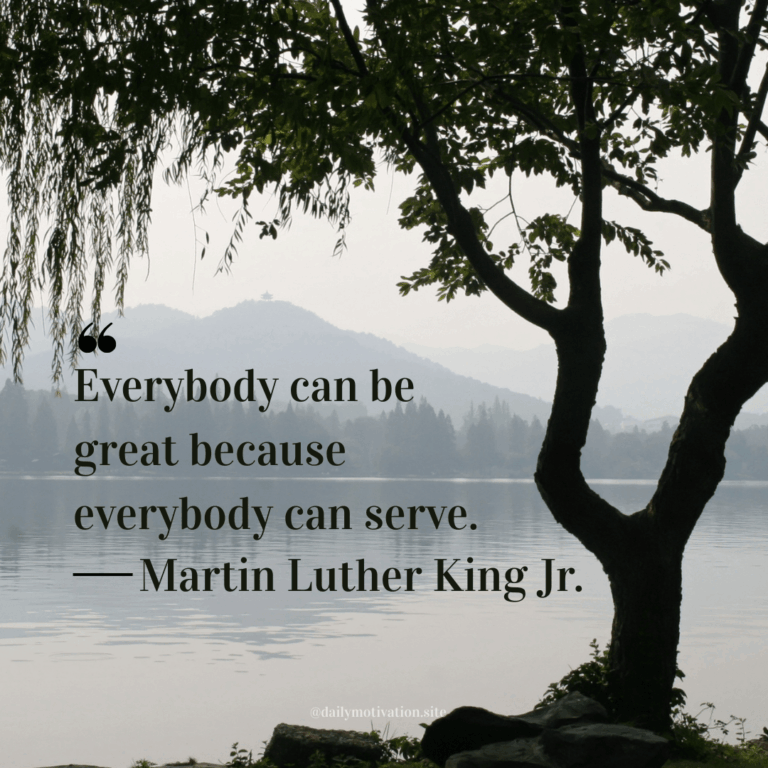 A tree sits near a calm lake.