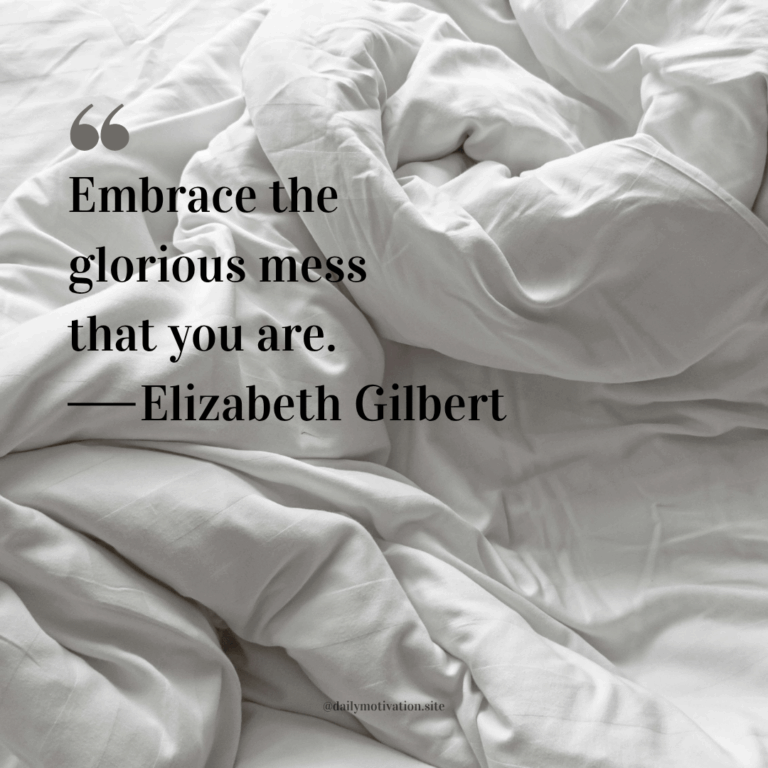 A white rumpled duvet on a bed.