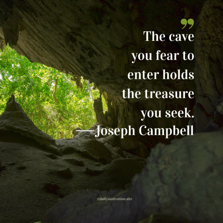 A view of a green forest from inside a cave.