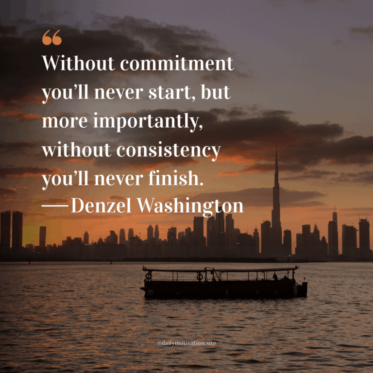 A ferry in the water with a city skyline at sundown in the background.