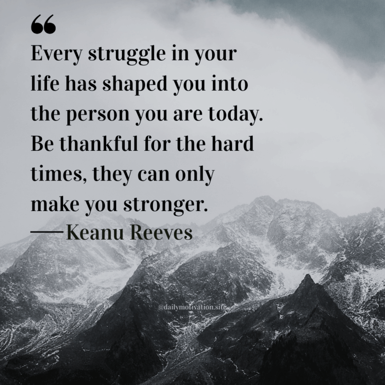 A grey sky above vast mountains.