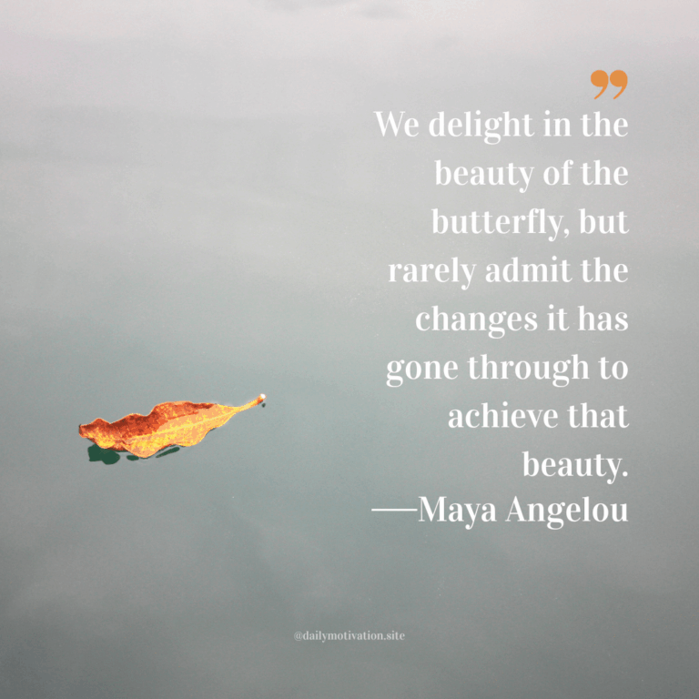 An orange leaves floats on grey water.