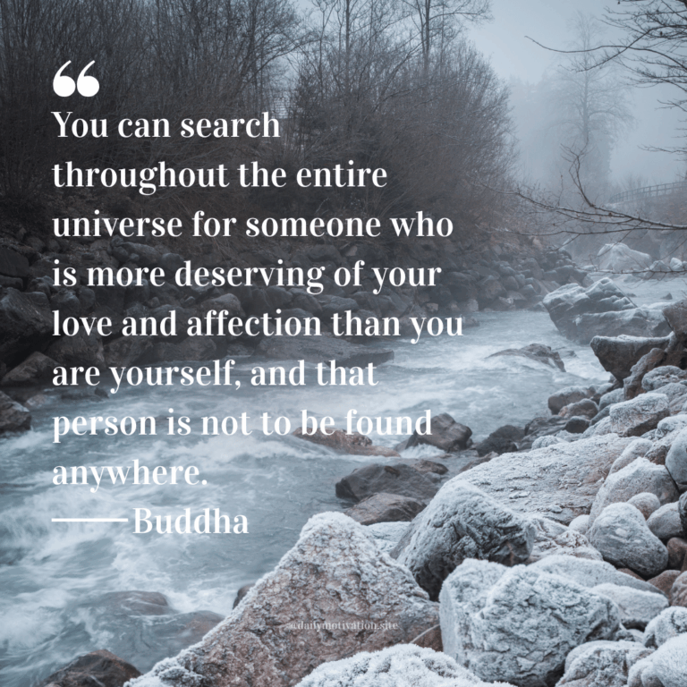 Fog above a frigid stream lined by rocks and barren trees.