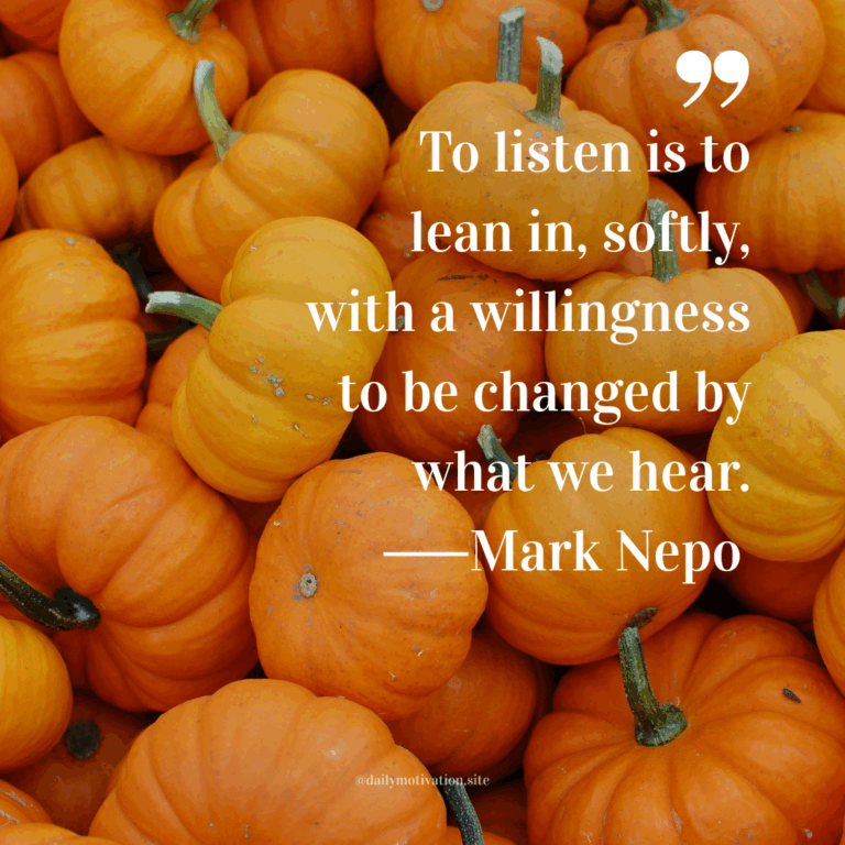 Pile of small orange pumpkins filling the frame.