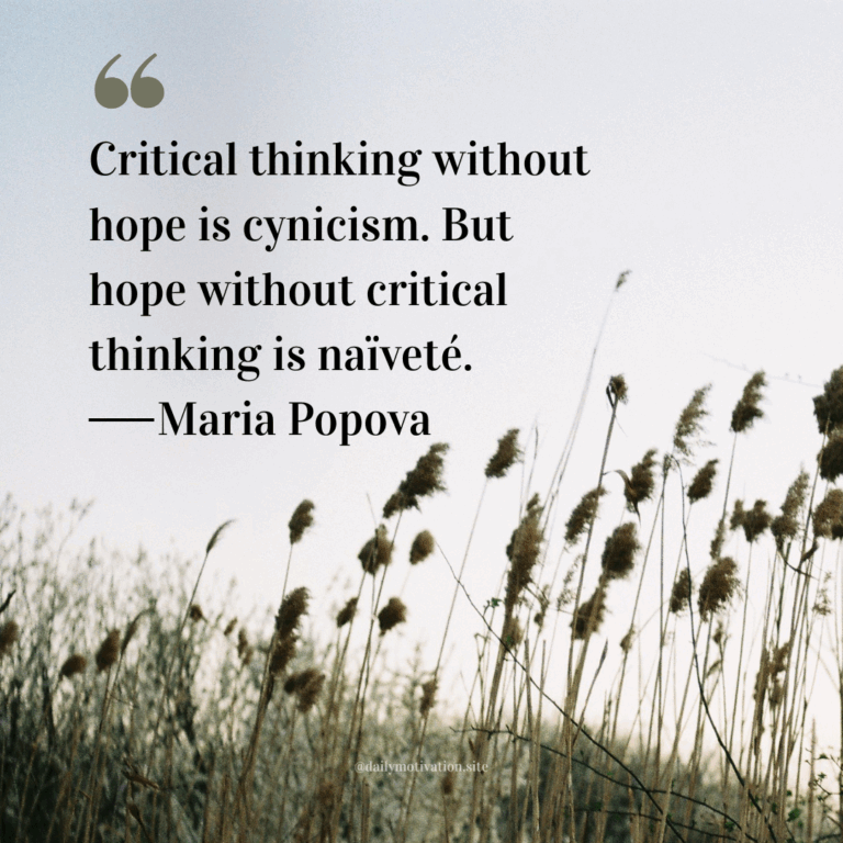 Tall dried grass and reeds swaying in the wind under a pale sky.