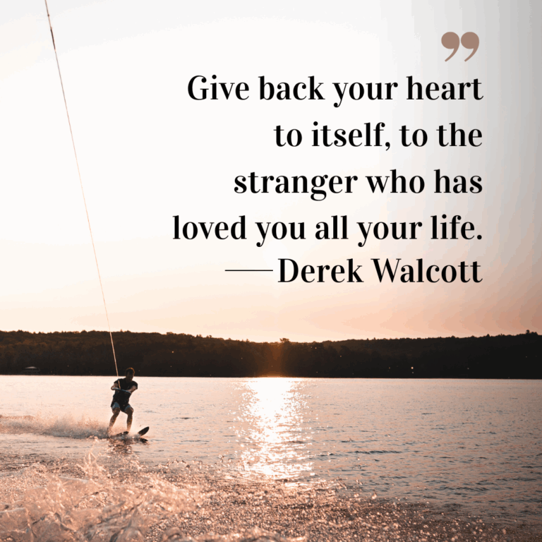 Person wakeboarding on a lake at sunset with golden light reflecting on the water.