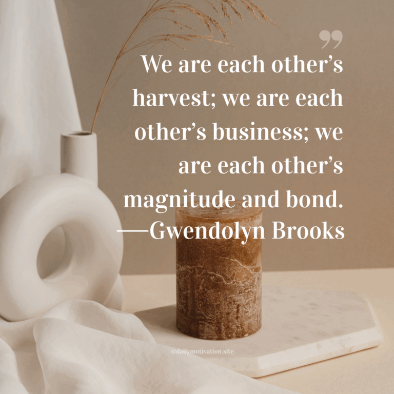 Minimalist ceramic vases and a stone candle on a soft fabric background.