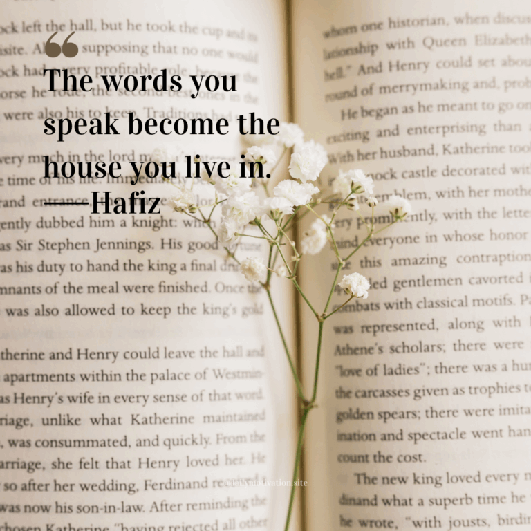 Open book with delicate white flowers placed across its pages.