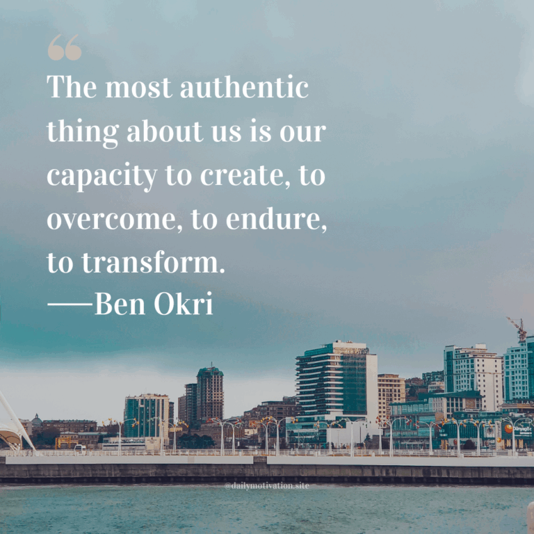 City skyline with modern buildings along a waterfront under a pale, overcast sky.